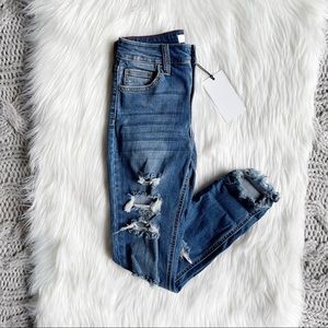 Medium wash distressed high waisted skinny jeans